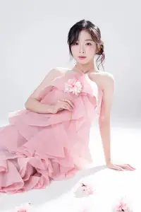 Discover Feminine Elegance: A Girl in a Pink Dress with Pristine Flowers - image 0