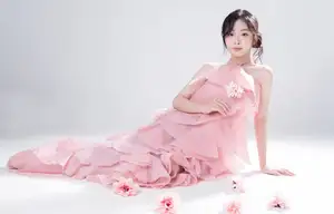 Discover Feminine Elegance: A Girl in a Pink Dress with Pristine Flowers - image 3