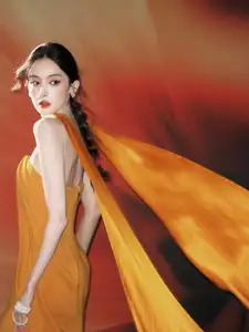 Captivating Beauty: Goddess in a Vibrant Orange Gown, Exuding Elegant Allure. - image 2