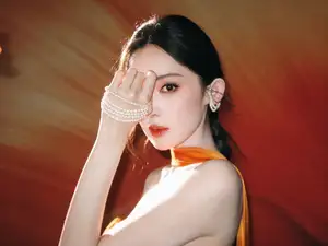 Captivating Beauty: Goddess in a Vibrant Orange Gown, Exuding Elegant Allure. - image 5