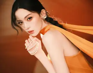 Captivating Beauty: Goddess in a Vibrant Orange Gown, Exuding Elegant Allure. - image 0
