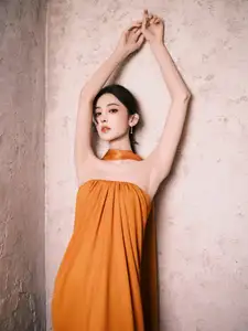 Captivating Beauty: Goddess in a Vibrant Orange Gown, Exuding Elegant Allure. - image 9