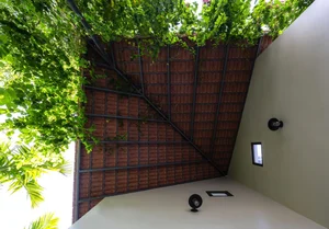1gian House: A Rustic Red-Tile Retreat by the River in Nghe An - image 1