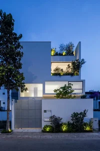 Minimalist White House Design in Ho Chi Minh City: A Serene Urban Oasis Featuring Lush Indoor Greenery and Modern Architecture - image 1