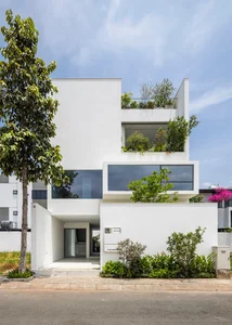 Minimalist White House Design in Ho Chi Minh City: A Serene Urban Oasis Featuring Lush Indoor Greenery and Modern Architecture - image 6