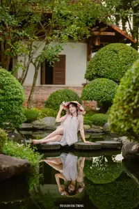 Graceful Young Woman in a Dreamy Garden: A Serene and Elegant Moment 1000025211 - image 1
