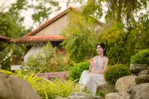 Graceful Young Woman in a Dreamy Garden: A Serene and Elegant Moment 1000025211 - image 3