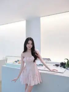 Gentle Charm: Beautiful Girl in Pink Floral Dress, Captivating Elegant Style. - image 2