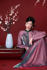 East Asian Grace: Elegant Lady in Traditional Attire & Cherry Blossoms - image 1