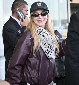 Lindsay Lohan and Husband Bader Shammas Arrive in New York City with Son Luai After Departing Dubai: Celebrity Family Travel Style - image 1