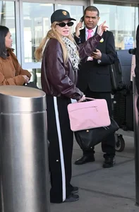 Lindsay Lohan and Husband Bader Shammas Arrive in New York City with Son Luai After Departing Dubai: Celebrity Family Travel Style - image 2