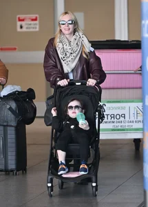 Lindsay Lohan and Husband Bader Shammas Arrive in New York City with Son Luai After Departing Dubai: Celebrity Family Travel Style - image 4