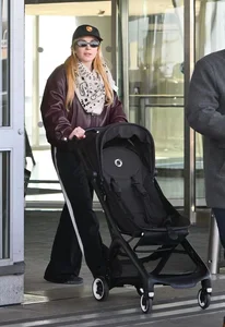 Lindsay Lohan and Husband Bader Shammas Arrive in New York City with Son Luai After Departing Dubai: Celebrity Family Travel Style - image 5