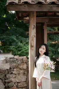 Timeless Elegance: Vietnamese Woman in Traditional Ao Dai Amidst Serene Backdrop - image 11