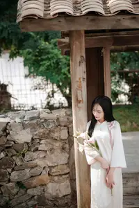Timeless Elegance: Vietnamese Woman in Traditional Ao Dai Amidst Serene Backdrop - image 12