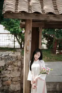 Timeless Elegance: Vietnamese Woman in Traditional Ao Dai Amidst Serene Backdrop - image 9