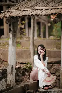 Timeless Elegance: Vietnamese Woman in Traditional Ao Dai Amidst Serene Backdrop - image 8