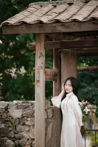 Timeless Elegance: Vietnamese Woman in Traditional Ao Dai Amidst Serene Backdrop - image 10