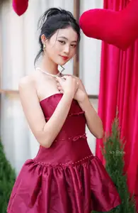 VGU No.187: Charming Woman in Red Dress Shines with Elegant Christmas Style. Discover Festive Fashion & Holiday Grace! - image 0