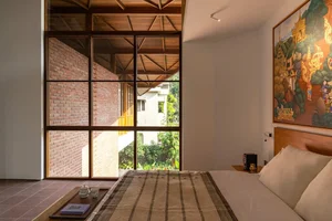 Sustainable 3-Story Home Featuring Traditional Coconut Wood Roofing and Local Architecture - image 11