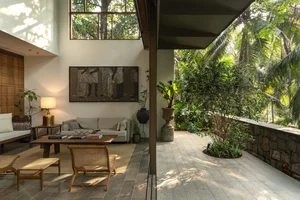 Sustainable 3-Story Home Featuring Traditional Coconut Wood Roofing and Local Architecture - image 19