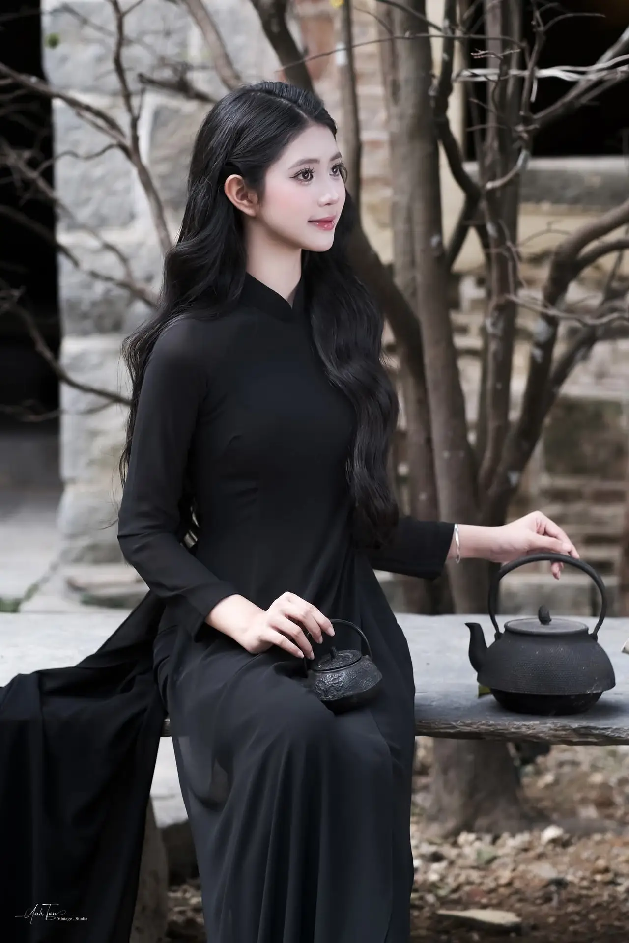 Timeless Beauty: Graceful Vietnamese Lady in Black Ao Dai Captivates with Asian Elegance.