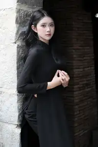 Timeless Beauty: Graceful Vietnamese Lady in Black Ao Dai Captivates with Asian Elegance. - image 6