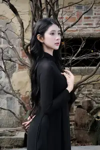 Timeless Beauty: Graceful Vietnamese Lady in Black Ao Dai Captivates with Asian Elegance. - image 3