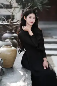 Timeless Beauty: Graceful Vietnamese Lady in Black Ao Dai Captivates with Asian Elegance. - image 2