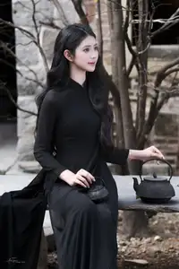 Timeless Beauty: Graceful Vietnamese Lady in Black Ao Dai Captivates with Asian Elegance. - image 0