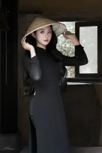 Timeless Beauty: Graceful Vietnamese Lady in Black Ao Dai Captivates with Asian Elegance. - image 4