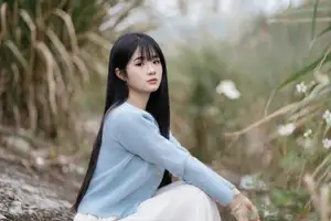 Explore Serene Beauty: Long-Haired Girl Immersed in Music Amidst Pampas Grass - image 4