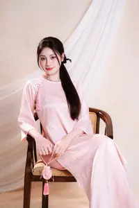 Vietnamese Beauty: Graceful in Traditional Pink Ao Dai and Conical Hat - image 1