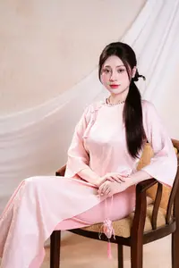 Vietnamese Beauty: Graceful in Traditional Pink Ao Dai and Conical Hat - image 5