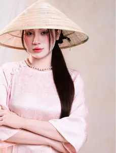 Vietnamese Beauty: Graceful in Traditional Pink Ao Dai and Conical Hat - image 2