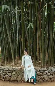 Vietnamese Grace: Elegant Portrait of a Young Woman in Lush Nature - image 9