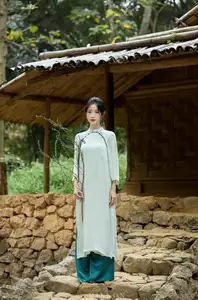 Vietnamese Grace: Elegant Portrait of a Young Woman in Lush Nature - image 0