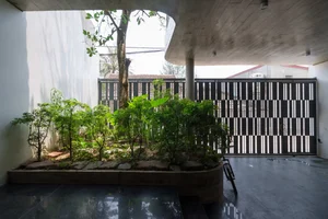 V1 House in Vinh: A 4-Story Townhouse Blending Open Architecture and Heritage - image 22