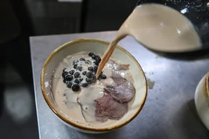 Exploring the Controversial Milk Tea Beef Noodles Trend in Hanoi - image 0