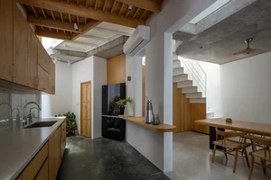 A Hanoi house in a narrow alley filled with natural light and ventilation - image 13