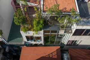 A Hanoi house in a narrow alley filled with natural light and ventilation - image 8