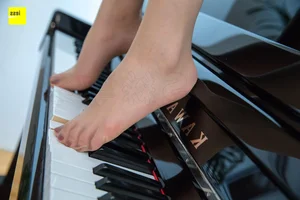 IESS Qiqi: Beautiful Feet on Black and White Piano Keys 2 - image 2