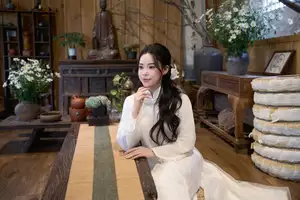 Elegant White Ao Dai: Pure Beauty of Vietnamese Woman with Pristine Orchids. - image 4