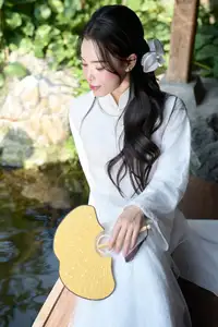 Elegant White Ao Dai: Pure Beauty of Vietnamese Woman with Pristine Orchids. - image 13