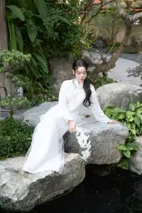 Elegant White Ao Dai: Pure Beauty of Vietnamese Woman with Pristine Orchids. - image 11
