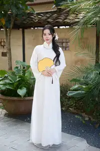 Elegant White Ao Dai: Pure Beauty of Vietnamese Woman with Pristine Orchids. - image 8