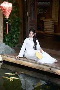 Elegant White Ao Dai: Pure Beauty of Vietnamese Woman with Pristine Orchids. - image 6