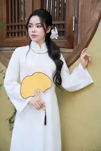 Elegant White Ao Dai: Pure Beauty of Vietnamese Woman with Pristine Orchids. - image 3
