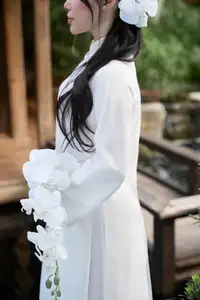 Elegant White Ao Dai: Pure Beauty of Vietnamese Woman with Pristine Orchids. - image 15
