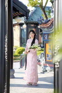 Graceful Asian Lady in Pink Ao Dai with Pristine White Lilies in Traditional Setting - image 6